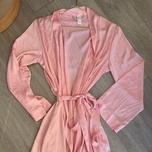 stars above pink satin robe